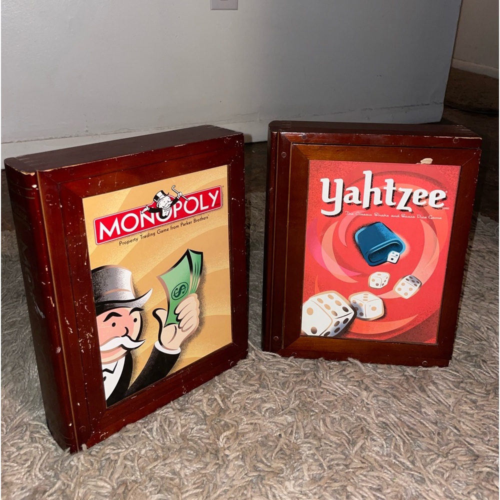 Vintage Monopoly (unopened) and Yahtzee games in collectors wooden book case
